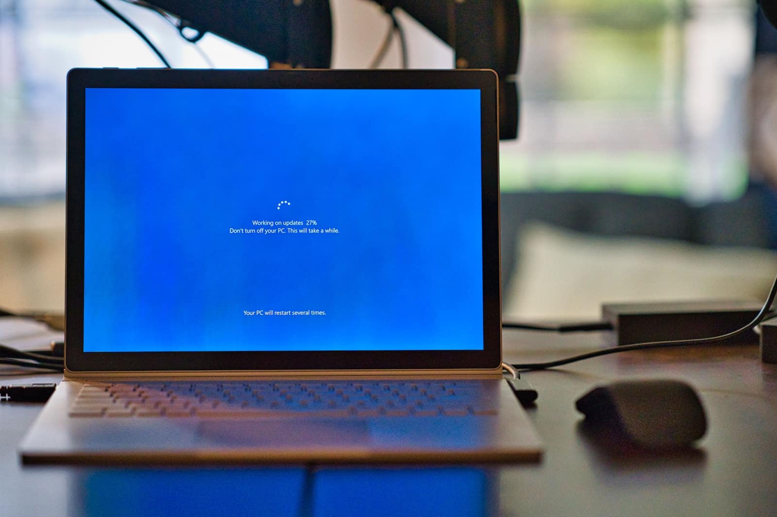 macbook pro on brown wooden table